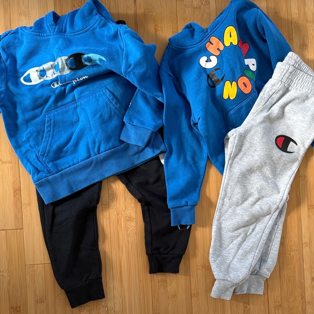 Champion Kids' Blue and Black Joggers Sets. Size 5
3 sweatshirts, 2 pants